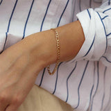 Saturn Goldkettenarmband